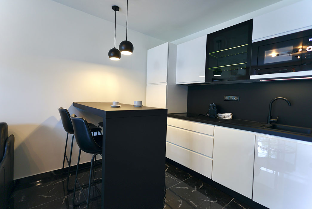 Kitchen of an apartment at Jardin de Babylone, naturist rental in Cap d’Agde